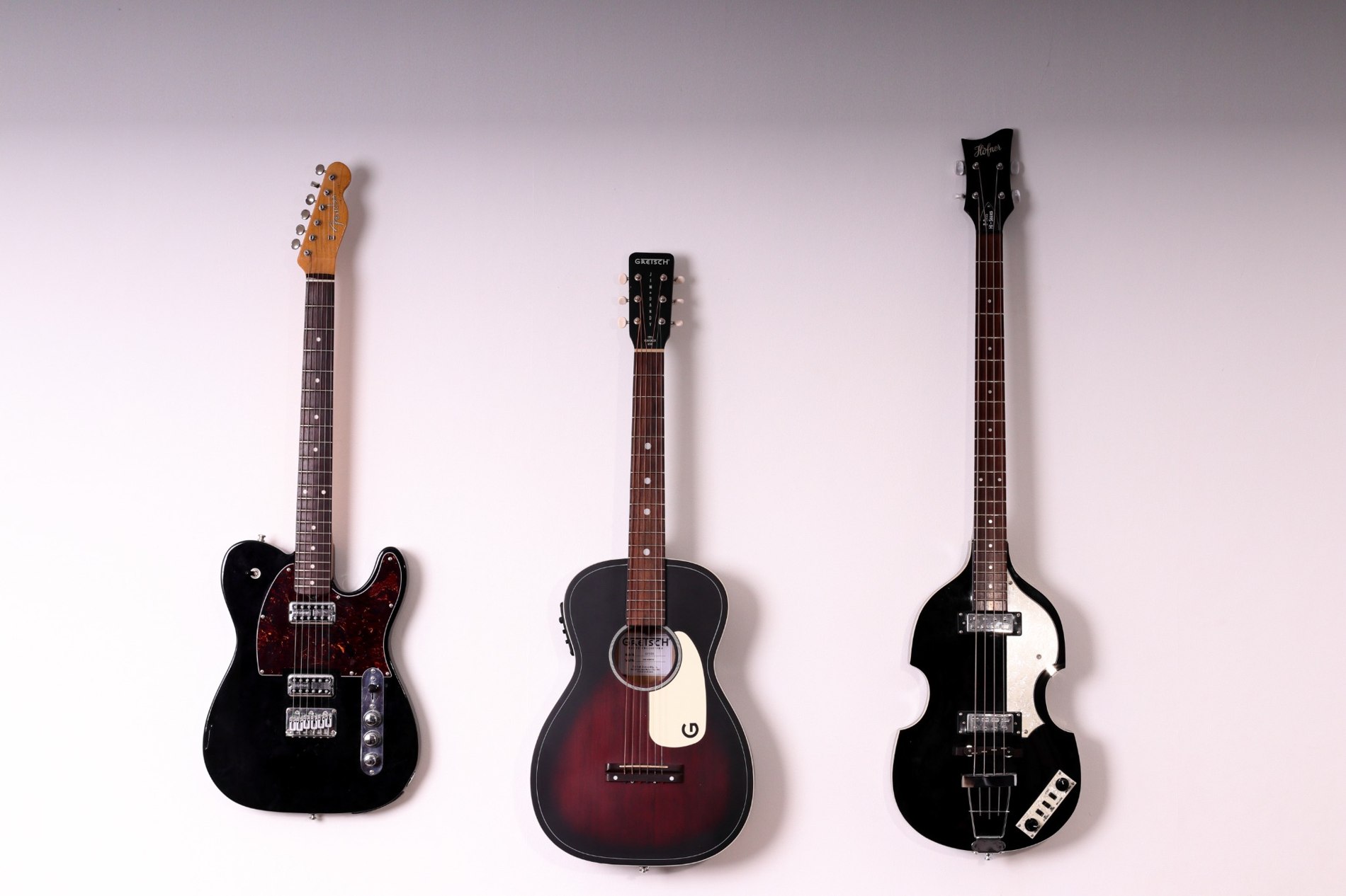 Three instruments hanging on a wall